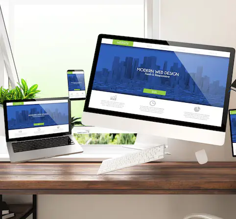 A desk with several devices, showcasing a web designing company’s goal of creating user-friendly and efficient websites.
